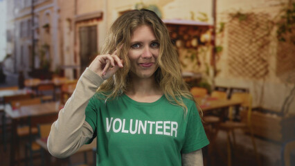 Woman finger pointing cafe blonde young crazy head volunteer gesture captured in candid footage conveys playful absurdity.
