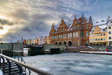Beautiful ancient houses on the Motlawa river embankment in Gdansk at winter
