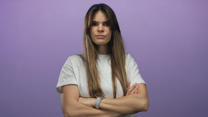 Woman expressing anger with hand gestures against a purple background, showcasing emotion and frustration through facial expressions in isolated environment.