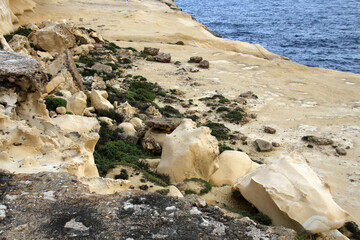 Limestone cliffs on the eroded coast of Xlendi, Gozo, Malta  