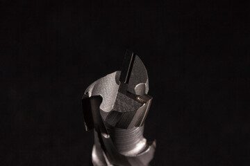 diamond wood processing cutter on black background close-up. carbide cutter. cnc tool.
