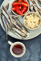 Unfiltered beer and with dried fish and squid.