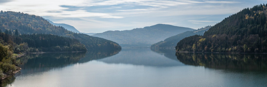 Peaceful Autumn Landscape Of Lake Izvorul Muntelui In Romanian Mountains