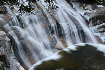Mumlava river in Krkono&scaron;e national park. waterfall in winter, snow and ice