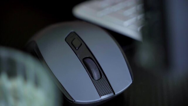 Close Up Hand Using Computer Mouse at Desk