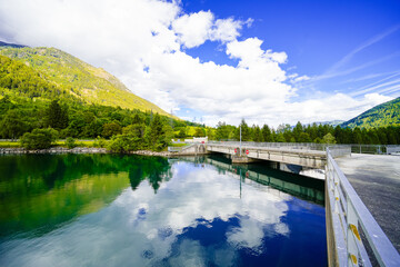 View of the Rottau reservoir and the surrounding green landscape. Nature by the lake near M&uuml;hldorf in Austria.
