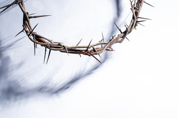 Jesus Crown of thorns shadow silhouette against textured gray surface, symbol spiritual pain and redemptive struggle Banner good friday background, Easter concept Christian