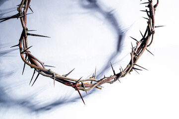 Jesus Crown of thorns shadow silhouette against textured gray surface, symbol spiritual pain and redemptive struggle Banner good friday background, Christian Easter concept