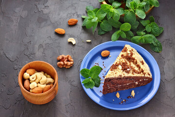 Decadent Chocolate Cake Slice with Nuts and Fresh Mint