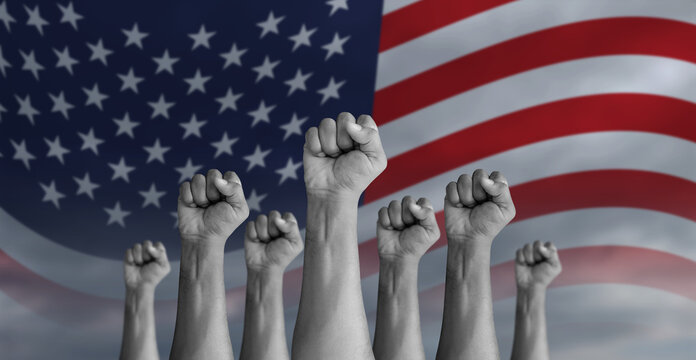 protesters hand with USA flag painted on the background. American peoples protesting.