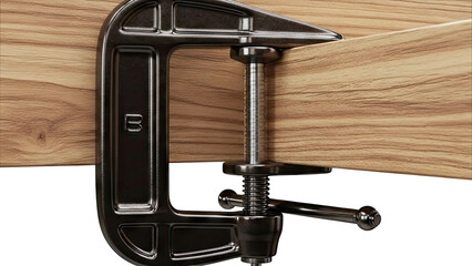 Close-up of a C-clamp holding a piece of wood