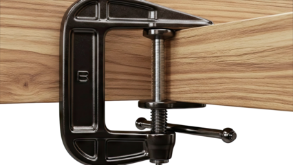 Close-up of a C-clamp holding a piece of wood