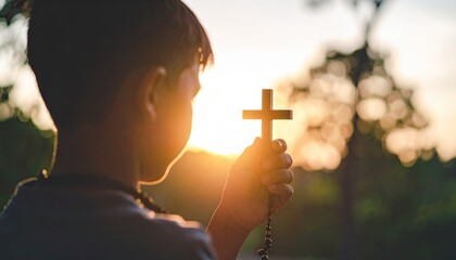 Child Holding Cross in Spiritual Portrait at Sunset