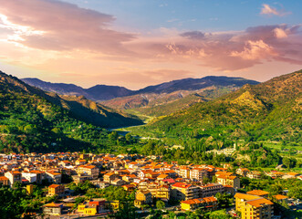 Mountain town view. Mountain landscape of  beautiful village in Sicily, Italy. A town in a beautiful mountain valley. Mountain valley town during sunset in evening light