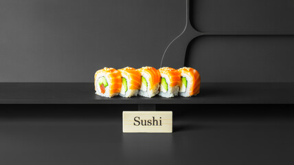 sushi on a black plate