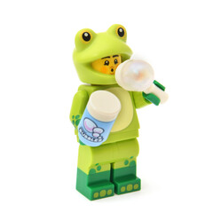 Obraz premium Lego minifigure of frog is blowing a bubble. Editorial illustrative image of collectable dolls edition 28.