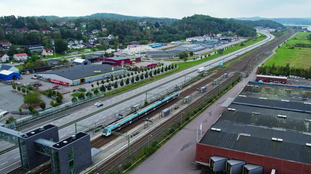 Aerial view of &Auml;lv&auml;ngen town, railway, and E45 highway near Gothenburg