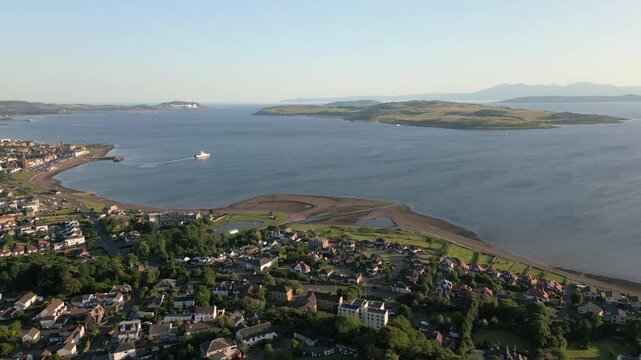Aerial orbit over Largs town with Great Cumbrae and Isle of Arran view