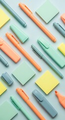 Colorful pens and sticky notes arranged on a light blue background for office supplies and stationery