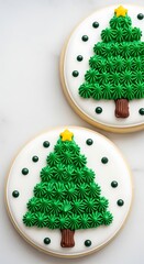 Decorated christmas tree cookies on white background with green frosting and yellow stars