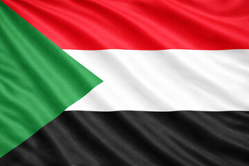 Obraz premium Sudan National Flag Waving in the Wind – High Contrast Horizontal Background