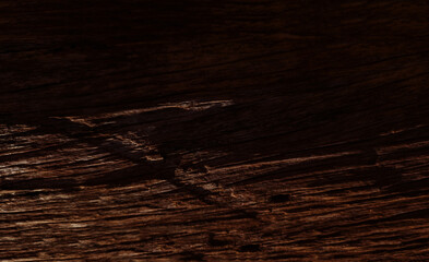 Deeply weathered dark wood texture with heavy horizontal grain and natural shadows. Rustic aged timber surface ideal for moody backgrounds masculine branding, and organic interior design