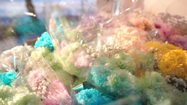 A bunch of bouquets of flowers. Lots of different flowers like multicolored Chrysanthemum