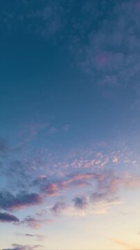 Gentle dusk sky featuring soft pink and blue hues with drifting clouds, Peaceful twilight horizon displaying pastel shades and slowmoving clouds for meditative visuals
