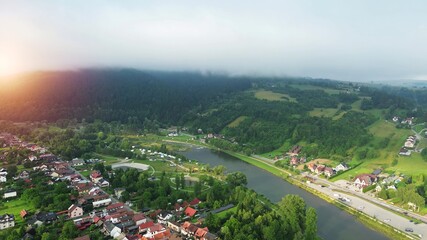 Fototapeta premium Rural mountain scenery with grasslands and forest mist