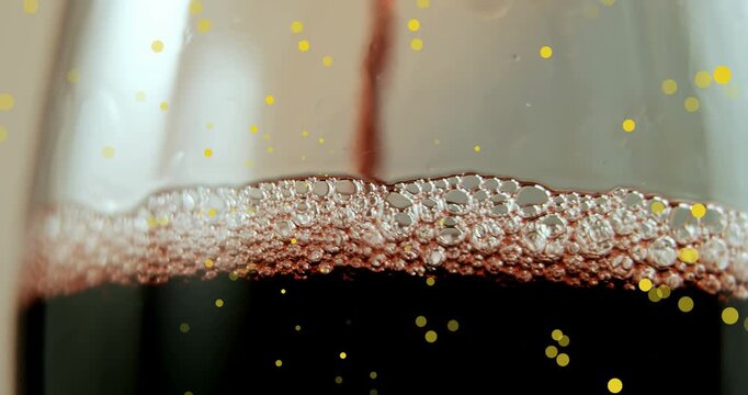 Animation of spots at christmas and glass of wine