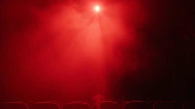 Abstract silhouette in dramatic red spotlight against dark background