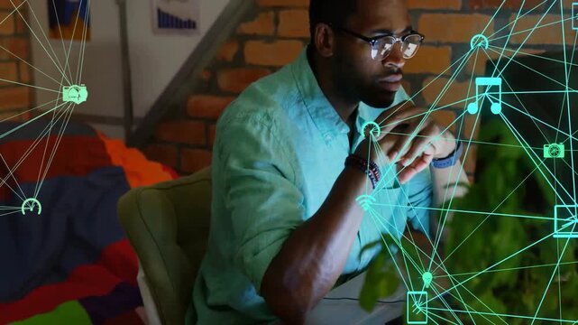 Graphic designer working at desk in cozy tech workspace, showing laptop wifi icons floating - Powered by Adobe