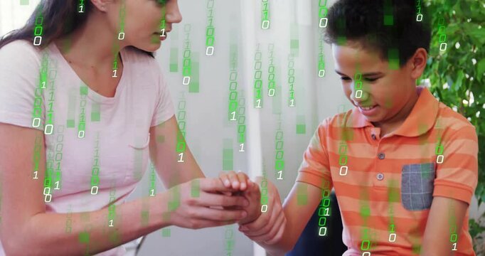 Woman guiding boy wrist and initiating green binary overlay demonstrating health check on sofa