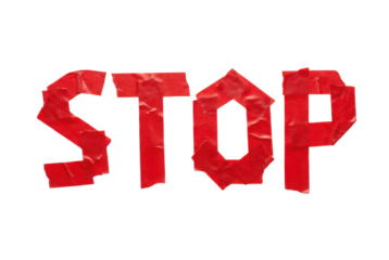 Bold red letters spelling "STOP" created with tape, emphasizing a clear and urgent message.
