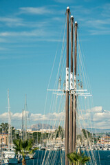 Obraz premium Majestic Sailing Yacht Masts in Scenic Marina