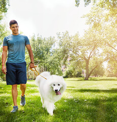 Happy man, leash or walking with dog in nature for outdoor bonding or fresh air together. Male...