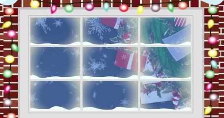 Animation of view of snowflakes falling over christmas decorations from decorated window frame - Powered by Adobe