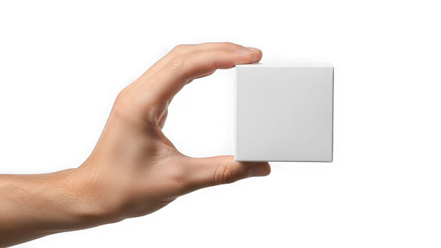 Hand holding white cube on transparent background