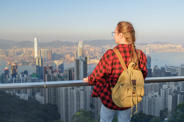 Female tourist enjoying view of Hong Kong from Victoria Peak
