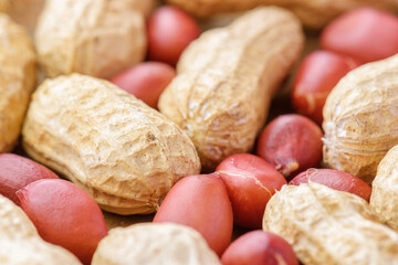 Closeup view of fresh peanuts on wooden table