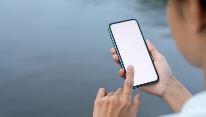 Woman Uses Phone By Water.