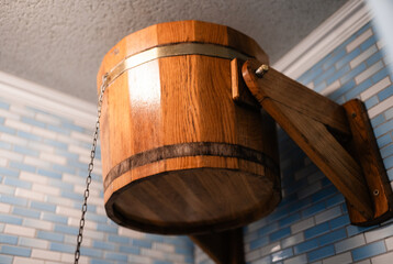 Wooden bucket for sauna and bath, perfect for water rituals and relaxation.