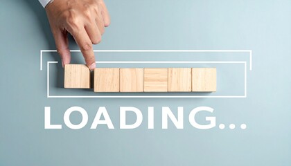 Hand placing wooden block into progress bar made of blocks, “LOADING...” text below on blue background.