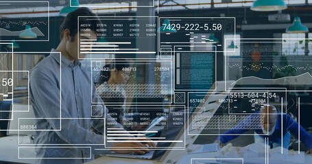 Man typing on laptop at standing desk, activating floating data panels and refining design analysis - Powered by Adobe