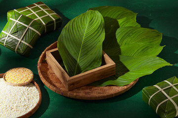 Chung cake with natural dong leaves arrangement. Creative scene for clean Tet backgrounds, food...