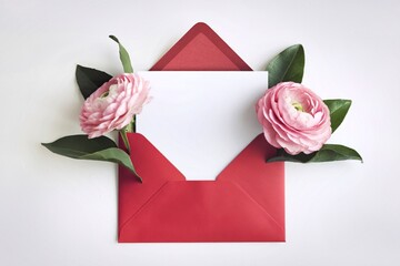 A photo of a red envelope opened to reveal a blank white card