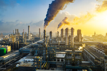 Aerial view of a large chemical plant and oil refinery with smoking chimneys in industrial area