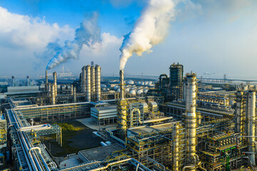 Aerial view of an oil refinery and chemical plant with smoking chimneys in industrial area