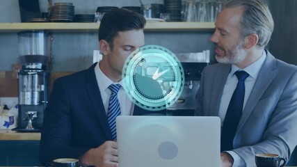 Animation of clock over caucasian businessmen using laptop - Powered by Adobe