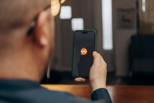 iPhone display with Reddit social media app